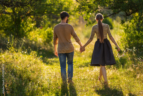 happy young couple walking in nature