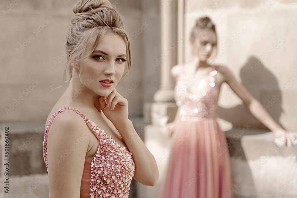European girls bridesmaids in pink dresses having fun