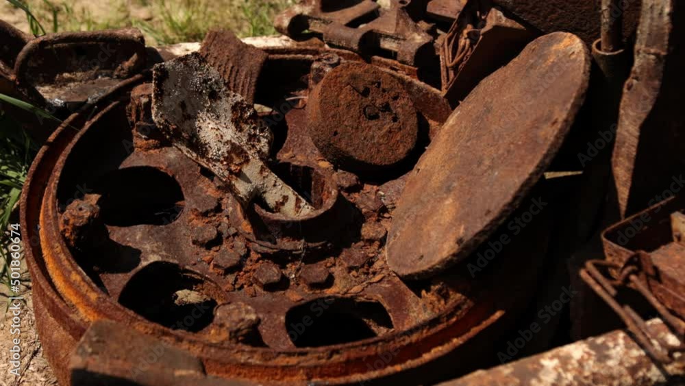 Military rusty metal parts. Elements of world war 2 a lot of destroyed things after battle and the influence of time. Soldiers personal belongings Military rusty metal parts. Elements of world war 2 a lot of destroyed things after battle and the influence of time. Soldiers personal belongings