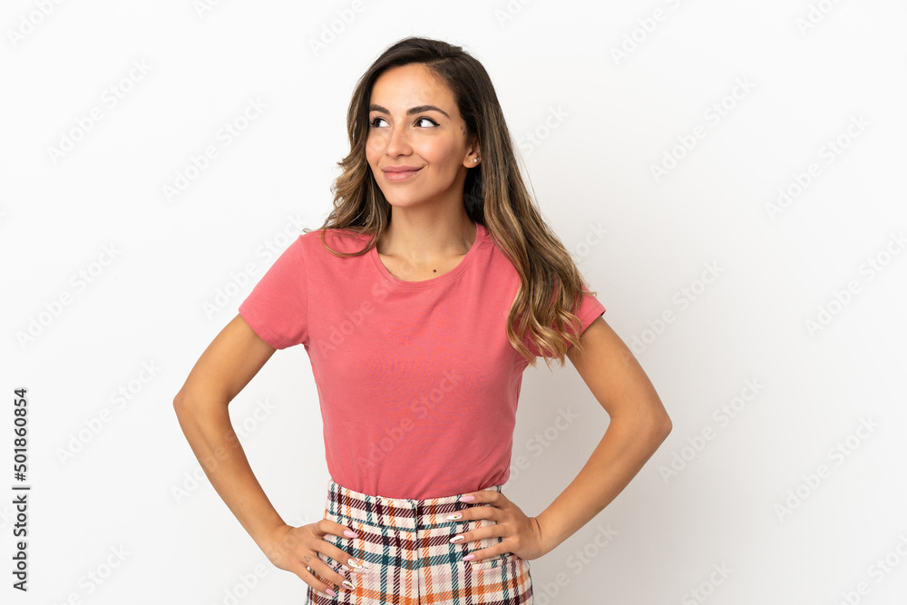 Young woman over isolated background thinking an idea while looking up Young woman over isolated background thinking an idea while looking up