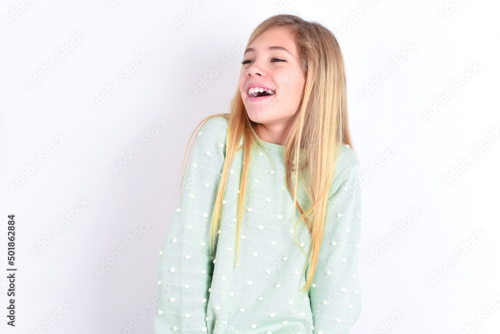 little caucasian kid girl wearing fashion sweater over blue background very happy and excited about new plans. little caucasian kid girl wearing fashion sweater over blue background very happy and excited about new plans.