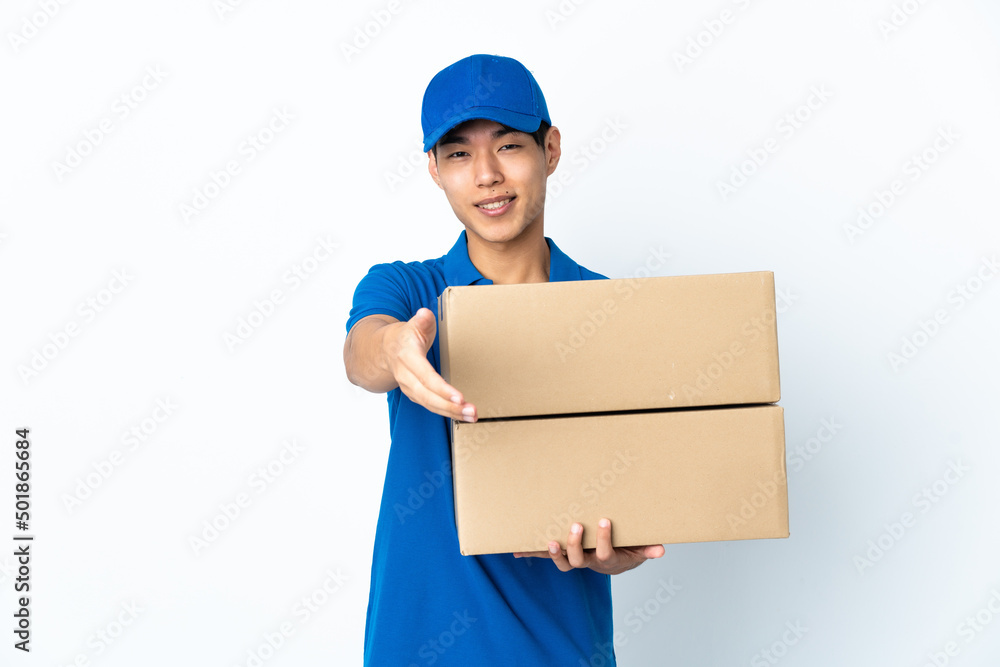 Delivery Chinese man isolated on white background shaking hands for closing a good deal Delivery Chinese man isolated on white background shaking hands for closing a good deal
