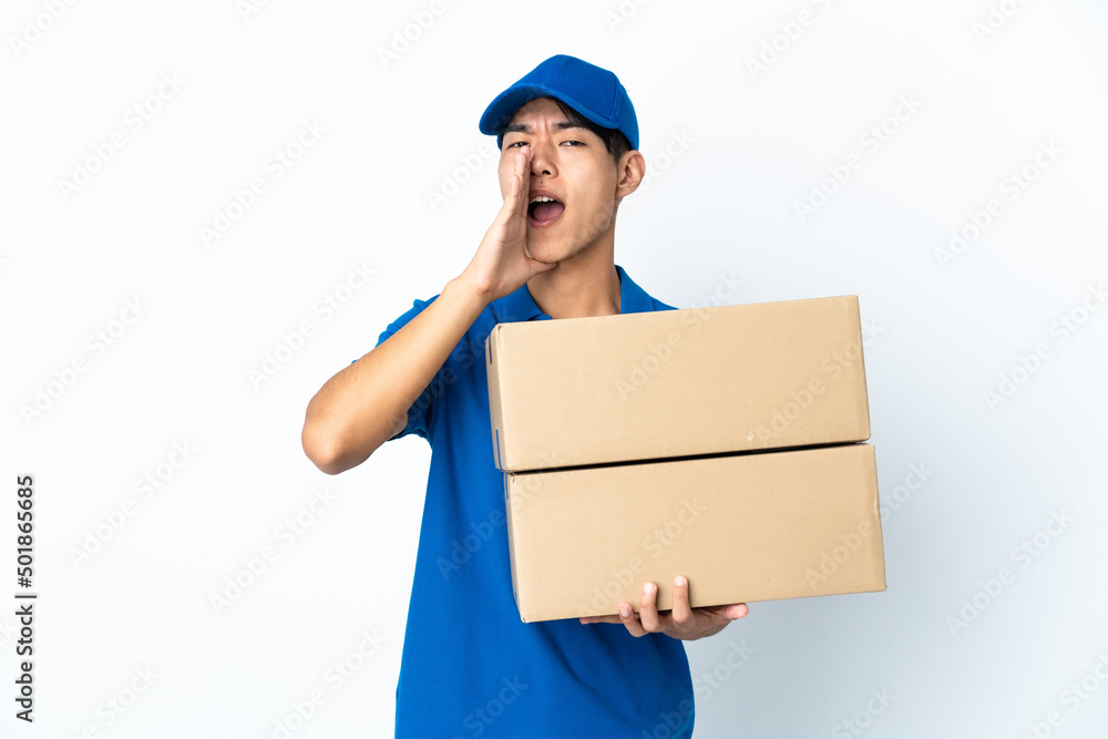 Delivery Chinese man isolated on white background shouting and announcing something Delivery Chinese man isolated on white background shouting and announcing something