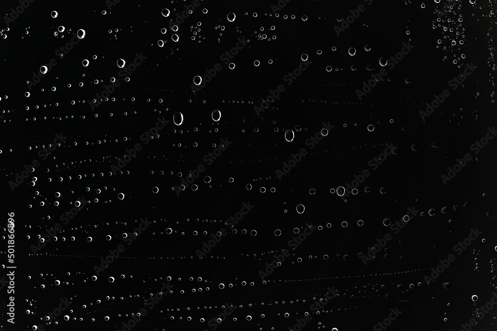 black wet background / raindrops for overlaying on window, concept of autumn weather, background of drops of water rain on glass transparent black wet background / raindrops for overlaying on window, concept of autumn weather, background of drops of water rain on glass transparent