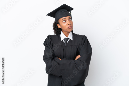 Young university graduate African American woman isolated on white background making doubts gesture while lifting the shoulders