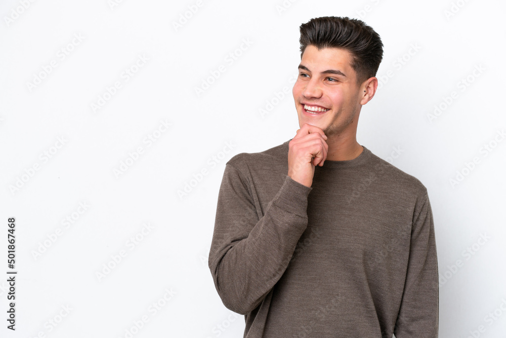 Young handsome caucasian man isolated on white bakcground looking to the side and smiling Young handsome caucasian man isolated on white bakcground looking to the side and smiling