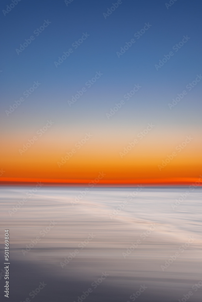 Abstract view of the sunset at the beach on Juist, East Frisian Islands, Germany.