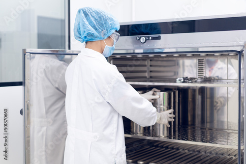 Unidentified operator is prepare the equipment to hot air oven for sterilization to prevent contamination, concept of laboratory, microbiology in pharmaceutical industry.