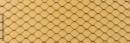 New yellow slate facade background. Slate facade texture. Panoramic image