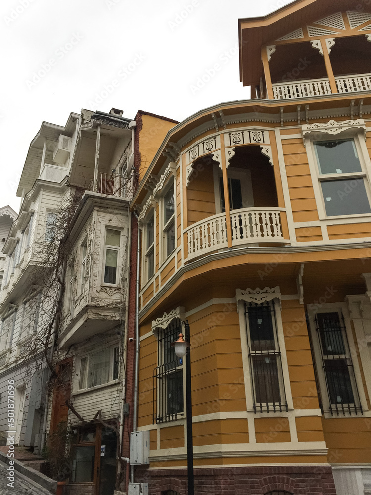 Naklejka premium Beautiful wooden houses in Arnavutkoy, Istanbul. Beyazgul street view. Street view of Arnavutkoy area, Istanbul. Historical neighbourhood famous for ottoman wooden houses