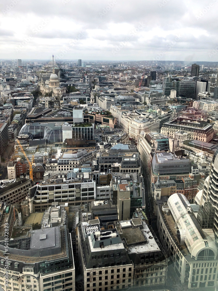 Aerial View of skyline of City of London, England, UK. View from Sky Garden. Panoramic image of London under the cloudy sky