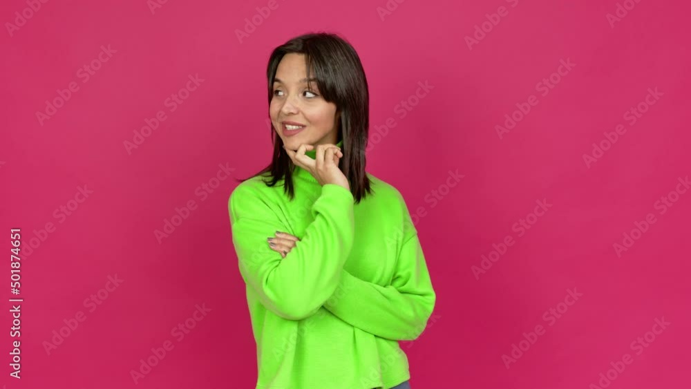 Young brunette woman standing and thinking an idea pointing the finger up over isolated background Young brunette woman standing and thinking an idea pointing the finger up over isolated background