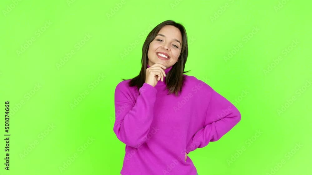 Young brunette woman smiling and looking to the front with confident face over isolated background. Green screen chroma key Young brunette woman smiling and looking to the front with confident face over isolated background. Green screen chroma key