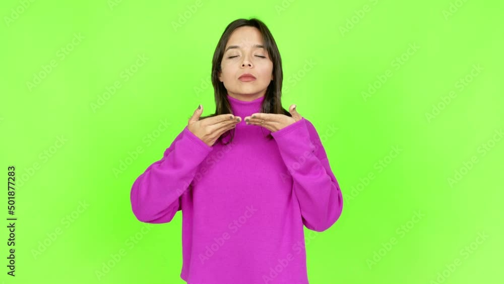 Young brunette woman in zen position over isolated background. Green screen chroma key Young brunette woman in zen position over isolated background. Green screen chroma key