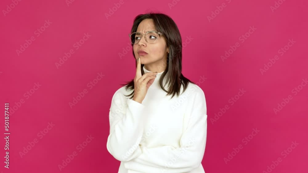 Young brunette woman with glasses and thinking Young brunette woman with glasses and thinking