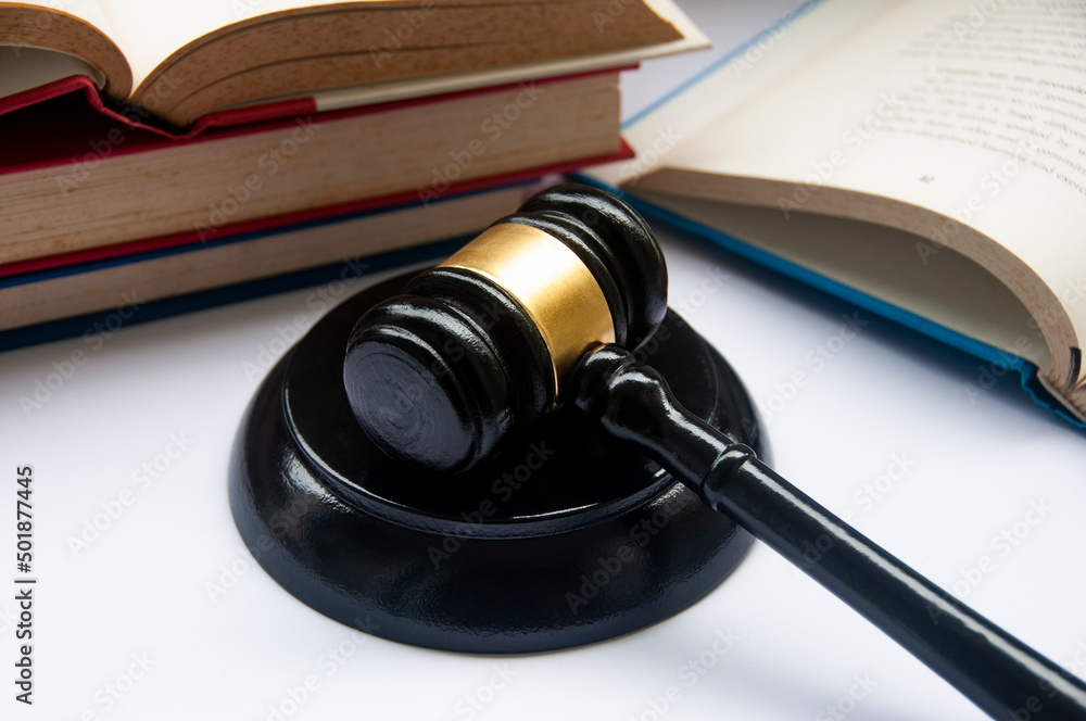 Lawyer gavel on white cover with books background. Law concept and copy space. Lawyer gavel on white cover with books background. Law concept and copy space.