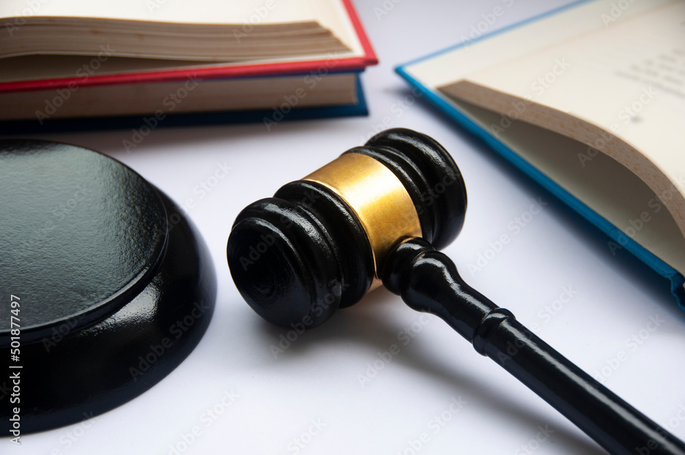 Lawyer gavel on white cover with books background. Law concept and copy space. Lawyer gavel on white cover with books background. Law concept and copy space.