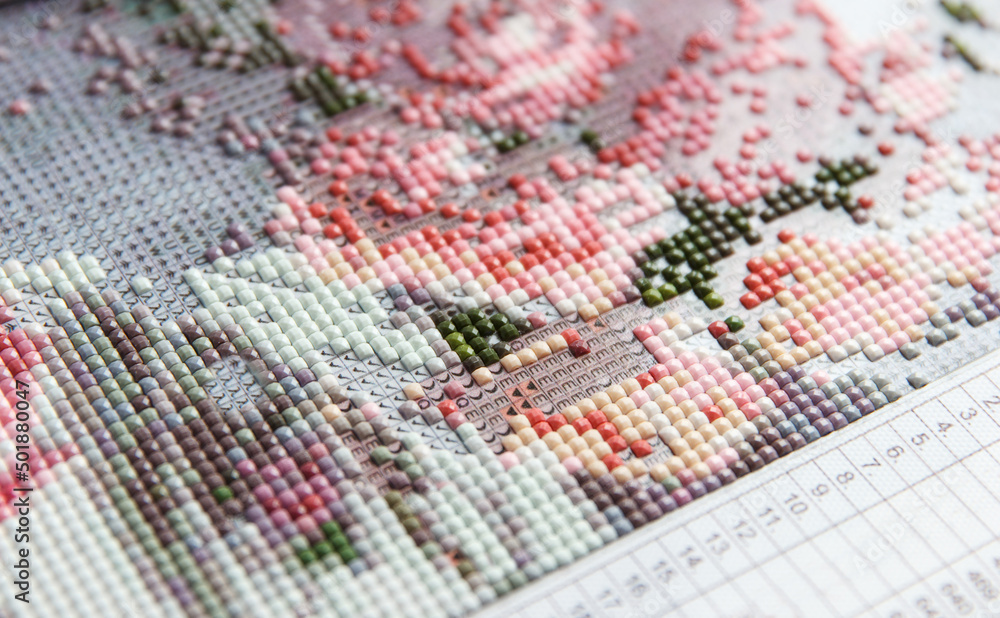Handmade process of creating and collecting 3D painting from acrylic multicolored rhinestones Handmade process of creating and collecting 3D painting from acrylic multicolored rhinestones