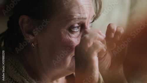 Elderly woman crying, closeup view