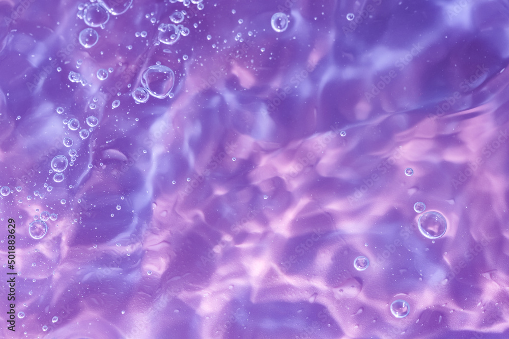 Abstract background. The texture of the waves on a blue background. Bubbling water, splashes and drops. Abstract background. The texture of the waves on a blue background. Bubbling water, splashes and drops.