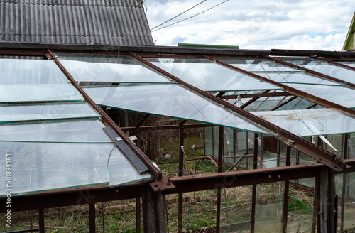 broken greenhouse with glass windows