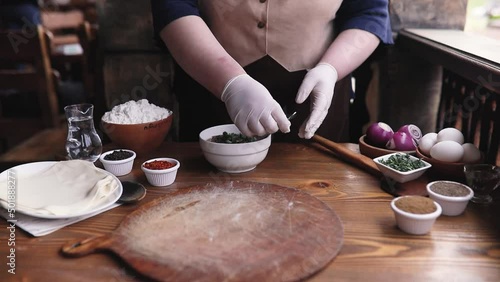 Georgian cuisine master class a female chef cooks khinkali in a restaurant. Traditional Caucasian food is khinkali.