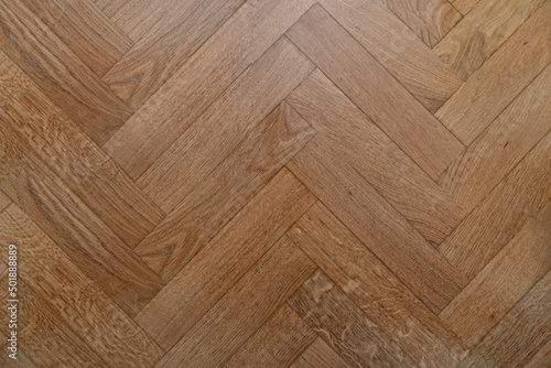 herringbone-laid oak parquet boards. vector wood texture background