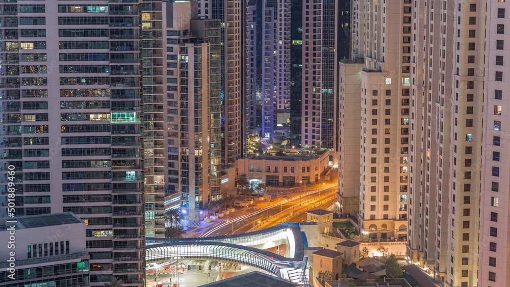 Overview to JBR and Dubai Marina skyline with modern high rise skyscrapers waterfront living apartments aerial night to day timelapse Overview to JBR and Dubai Marina skyline with modern high rise skyscrapers waterfront living apartments aerial night to day timelapse
