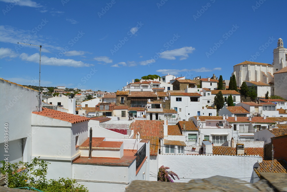 City with white houses in Spain at the mediterranean sea in summer.