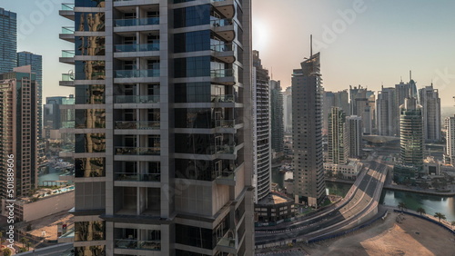 Panoramic view of the Dubai Marina and JBR area and the famous Ferris Wheel aerial timelapse