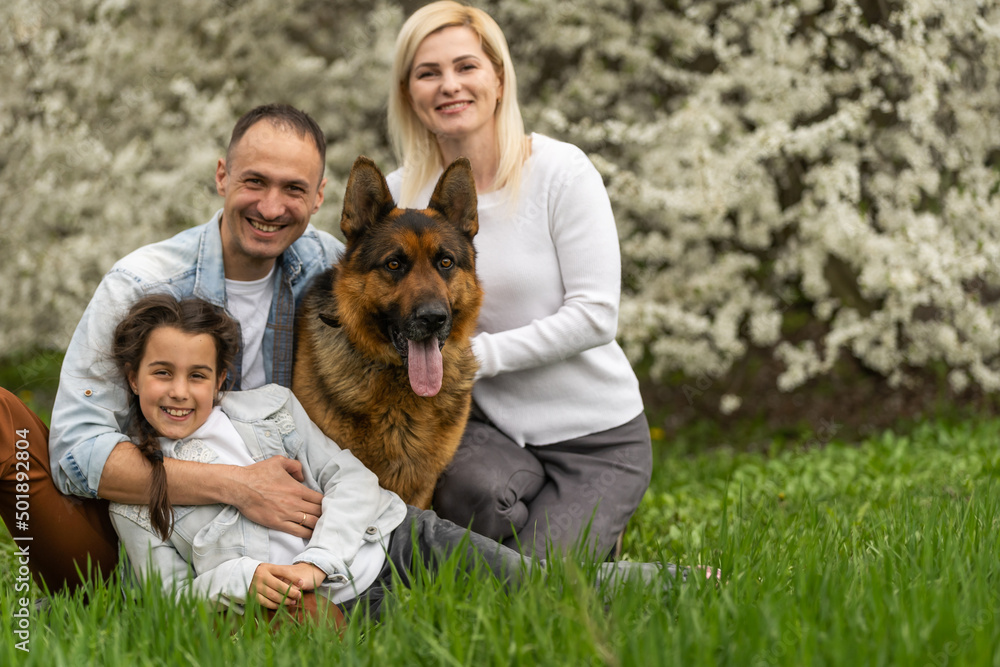 Happy family having picnic in nature. Smiling family picnicking in the park. spring nature Happy family having picnic in nature. Smiling family picnicking in the park. spring nature