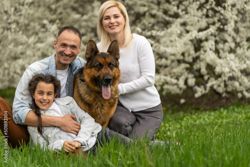 Happy family having picnic in nature. Smiling family picnicking in the park. spring nature