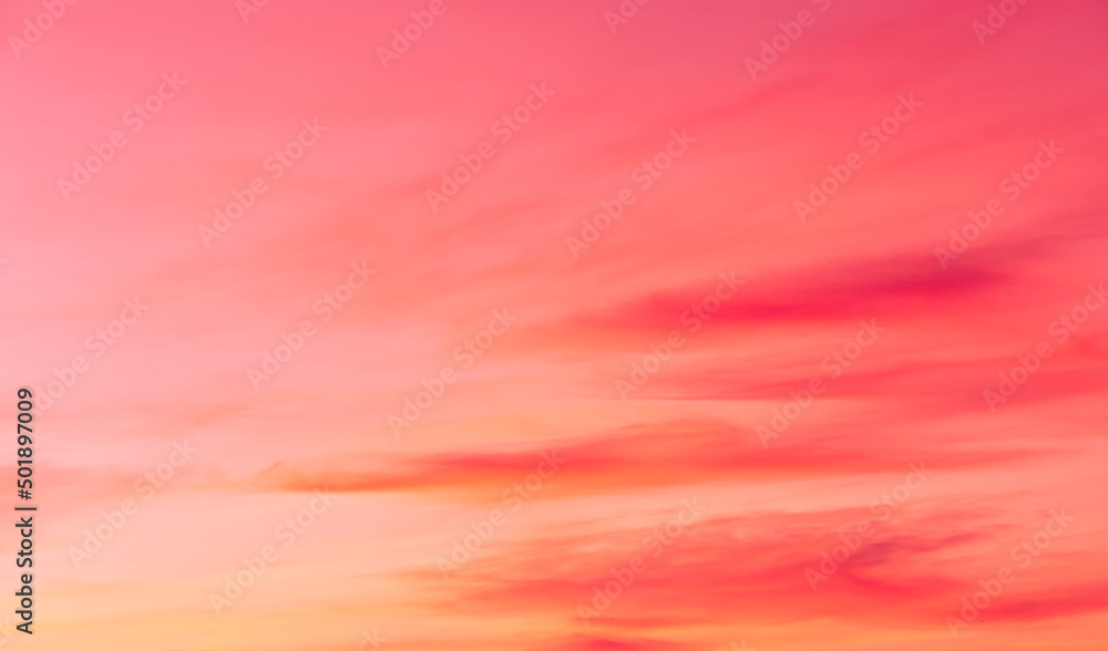 Romantic pink, orange and yellow pastel sky clouds in the evening sunset sky background 