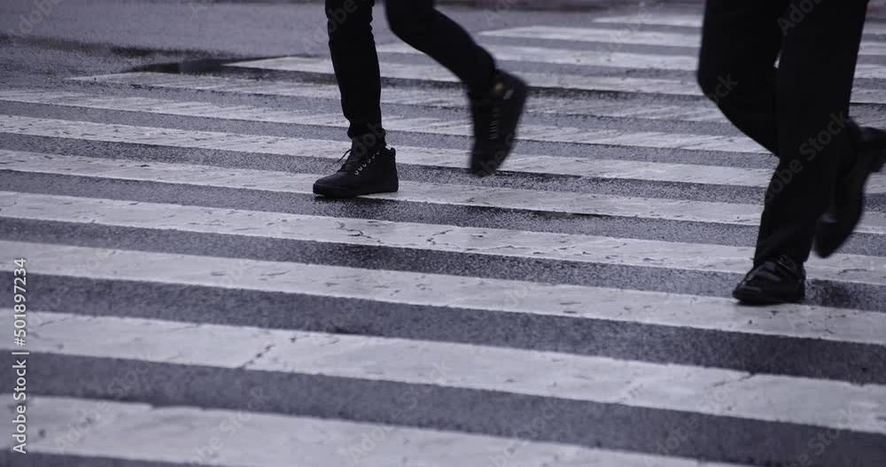 A slow motion of walking people at the crossing in Shibuya rainy day A slow motion of walking people at the crossing in Shibuya rainy day