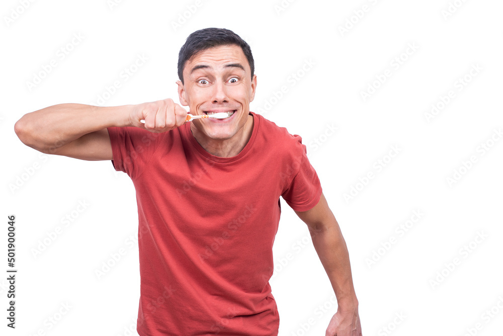 Expressive guy cleaning teeth with brush in studio Expressive guy cleaning teeth with brush in studio