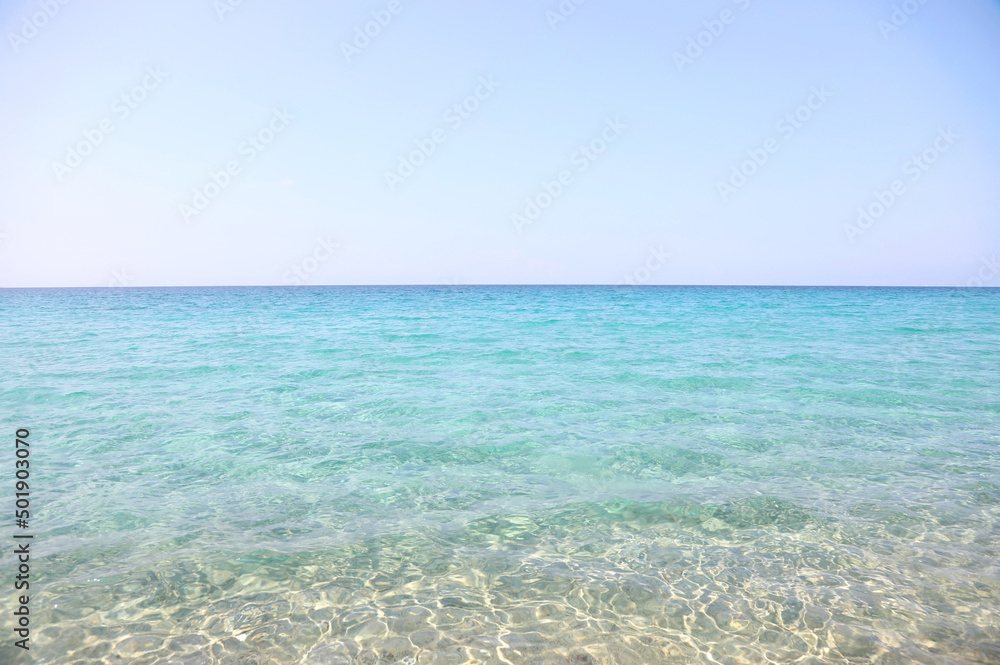 marine background with the clean water of the blue sea without other details only the uncontaminated nature ideal as a tropical backdrop