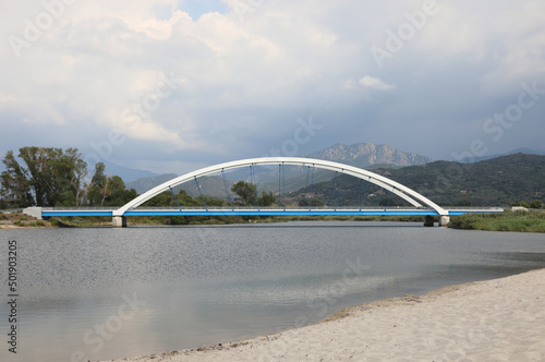 Modern bridge made with arches and steel ropes that crosses the river