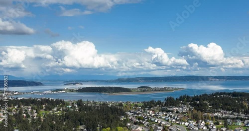 Aerial shot of Whidbey Island's Oak Harbor surrounded by clouds on a warm summer's day. photo