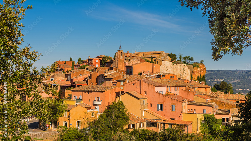 The ochre-red village Roussillon. Landscape with houses in historic ocher village Roussillon, Provence, Luberon, Vaucluse, France