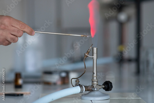 Flame test burning into chemistry laboratory. Lithium