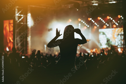 Fototapeta Black silhouette of crowd at concert - enjoy summer music festival