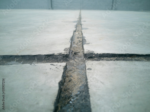 Asphalt in contraction joints, line is dirty, photo is depth of field