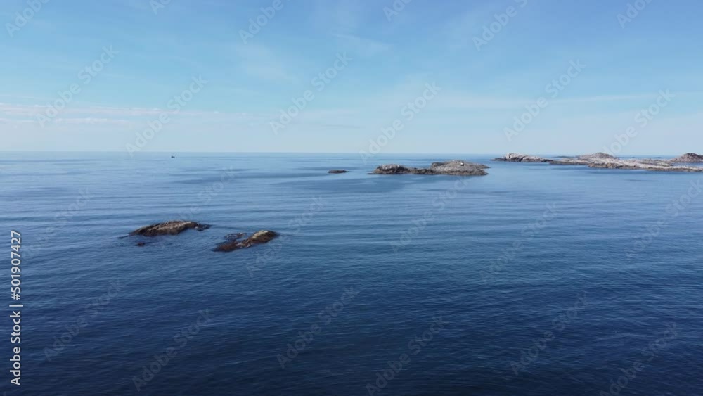 Aerial view of the sea wave and rocks of the coastline of Norway, Telavåg. Panoramic view of the rocks by the sea. The sea wave rolls along the shore. View of the sea coast from the air. Ocean space Aerial view of the sea wave and rocks of the coastline of Norway, Telavåg. Panoramic view of the rocks by the sea. The sea wave rolls along the shore. View of the sea coast from the air. Ocean space