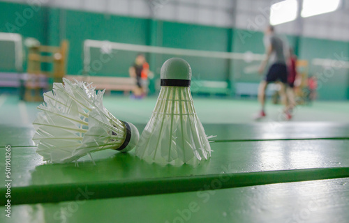 Shuttlecock on a chair in a badminton court, soft focus shot photo