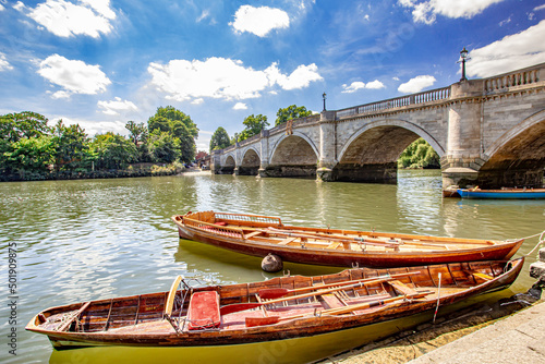 Inside out view of Rowing boats for rent under Richmond bridge at the river Thames, London, United Kingdom.