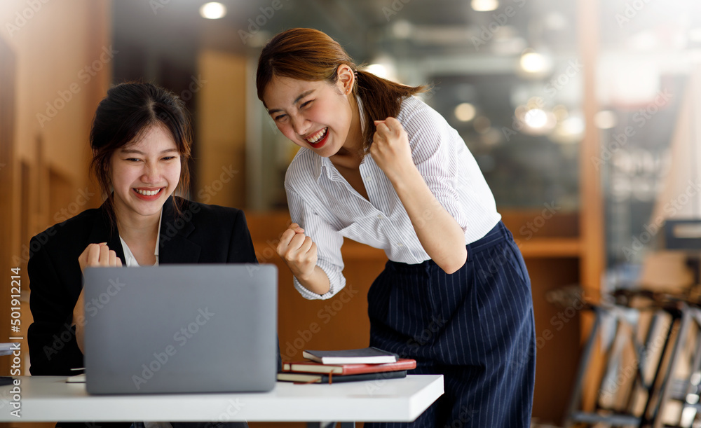 Team of Young Asian business creative businesspeople coworker in office Happy to be successful partnership teamwork celebrating achievement and success concept. Team of Young Asian business creative businesspeople coworker in office Happy to be successful partnership teamwork celebrating achievement and success concept.