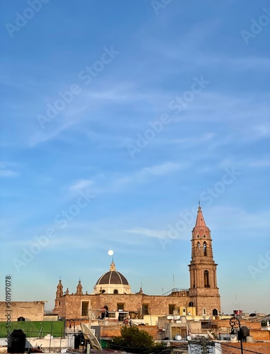 mexican church with the moon in the background