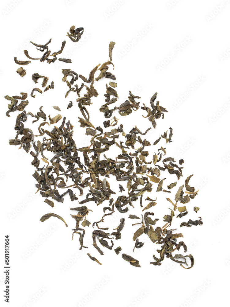 Scattered dry green leaves tea on white background.