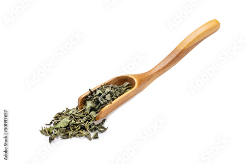 Bilde på lerret Dry leaves green tea in a wooden spoon on isolated background