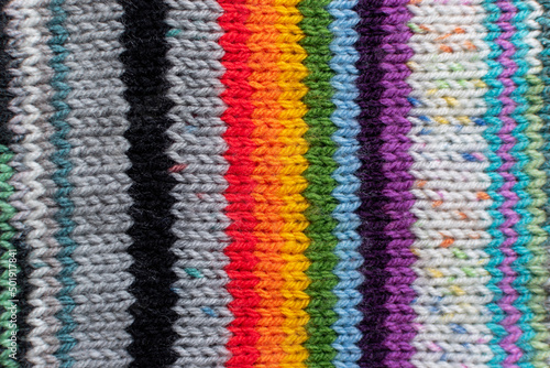 colourful knitting background backdrop with stripes in multi colour and rainbow 